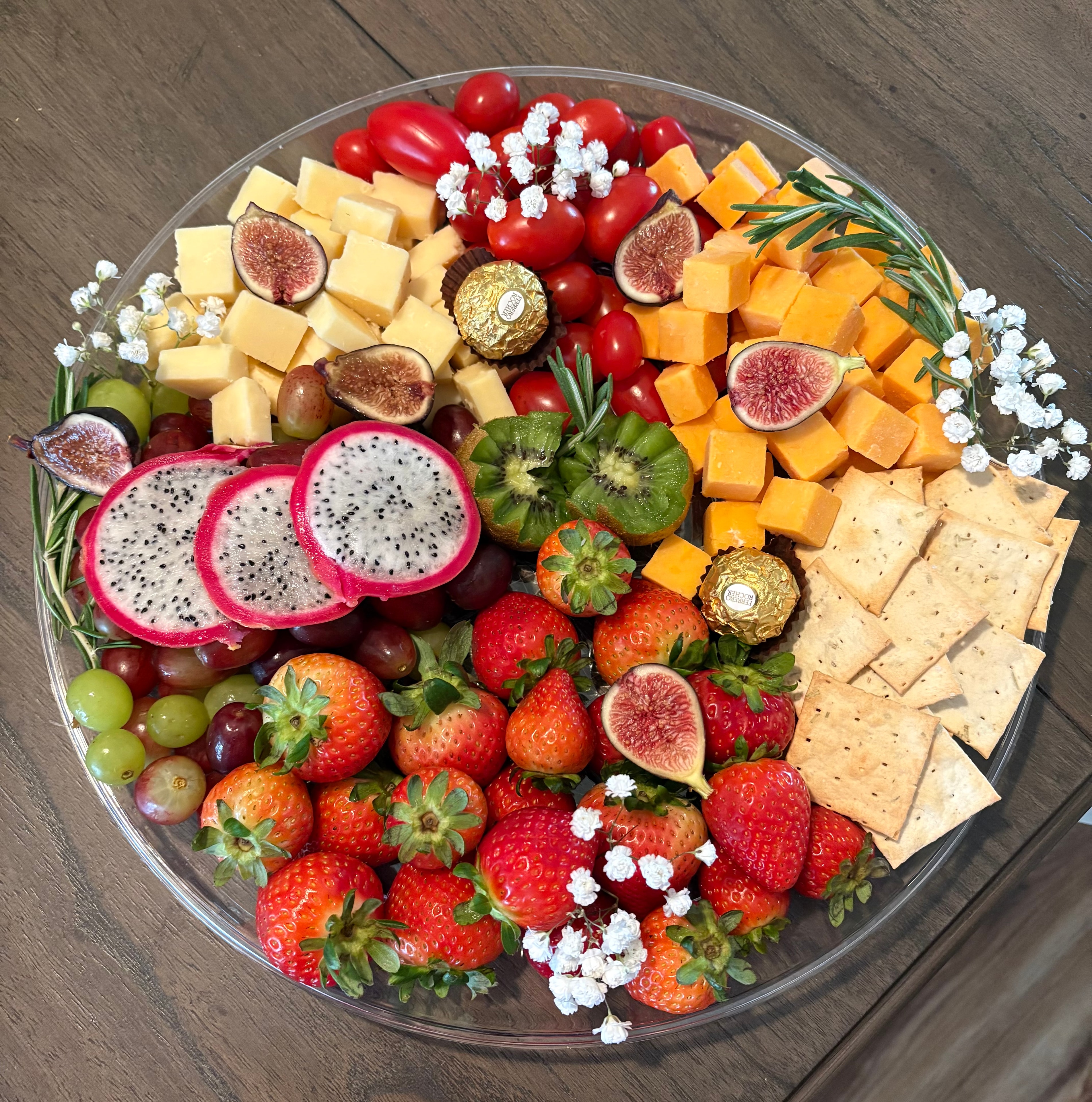 Hunt & Honey Berry & Bloom Platter with strawberries, grapes, dragon fruit, kiwi, figs, artisan cheeses, crackers and fresh herbs