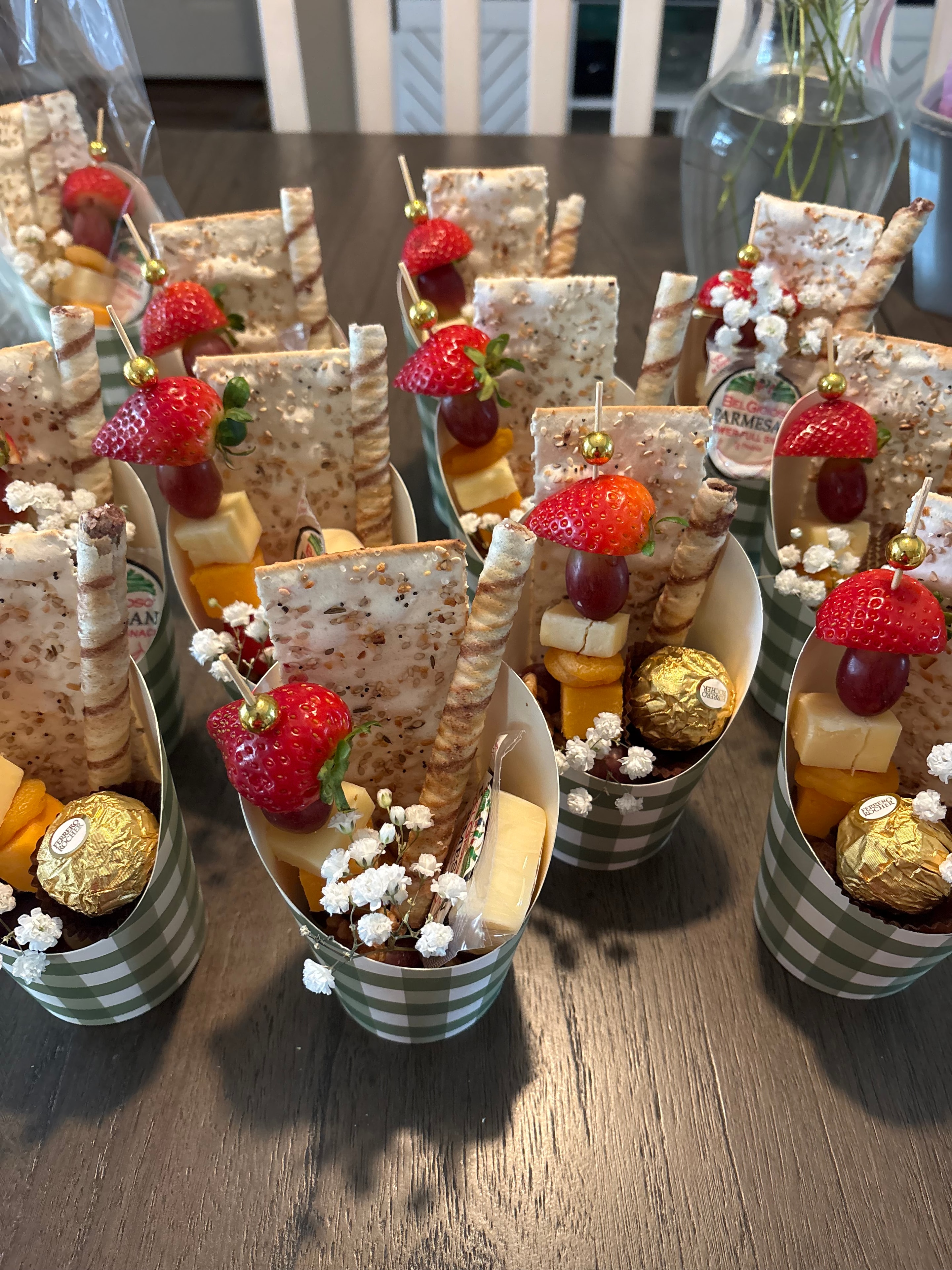 Hunt & Honey individual grazing cups with cheese, crackers, strawberries, grapes, and sweet treats