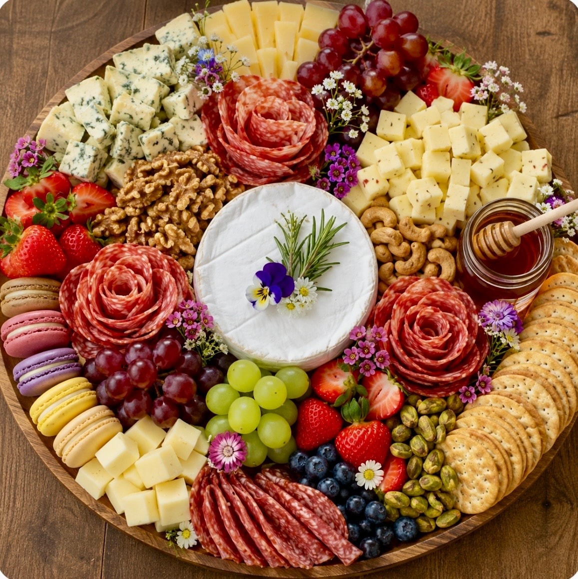 Hunt & Honey 16" signature brie platter with salami roses, macarons, fresh fruits, nuts, honey jar and edible flowers