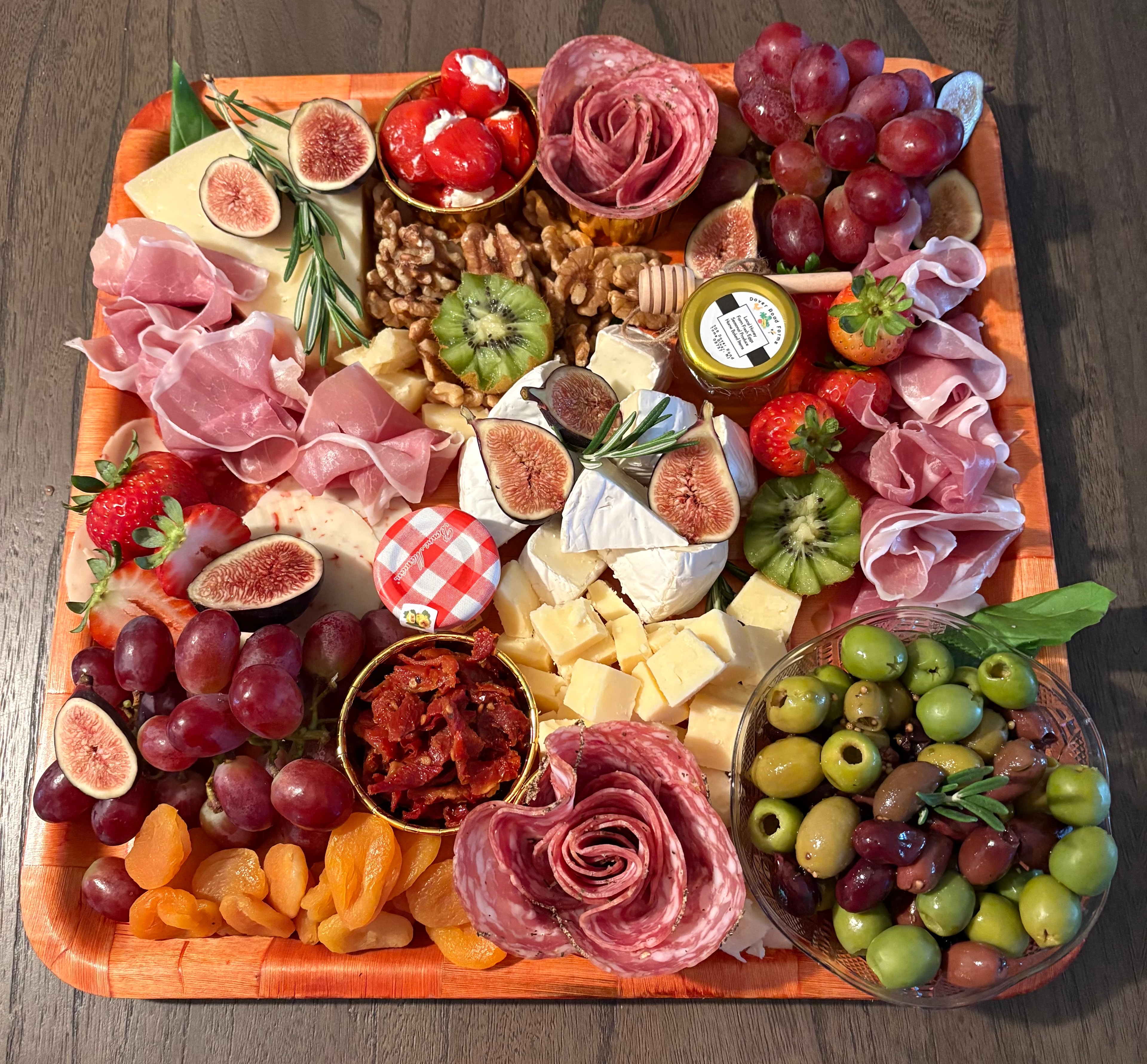 Hunt & Honey Italian charcuterie platter with artisan cheeses, cured meats, fresh figs, grapes, strawberries, olives, walnuts, dried apricots and honey